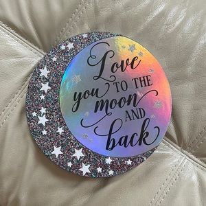 A wooden galaxy wall decoration.